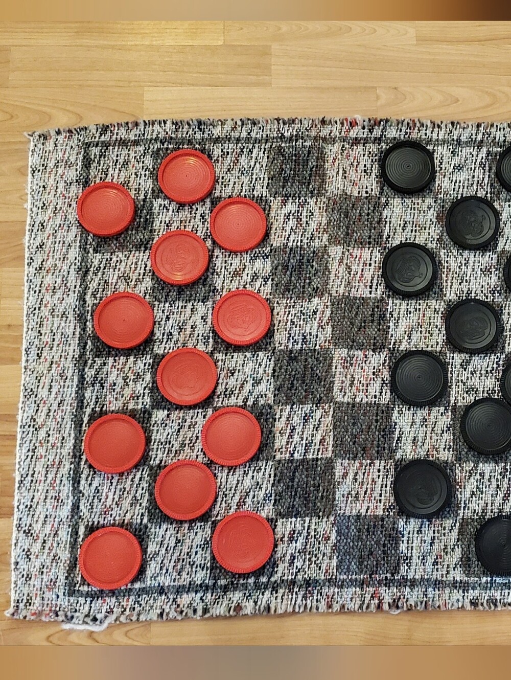 Handwoven Checkered Game Mat with Red and Black Checkers